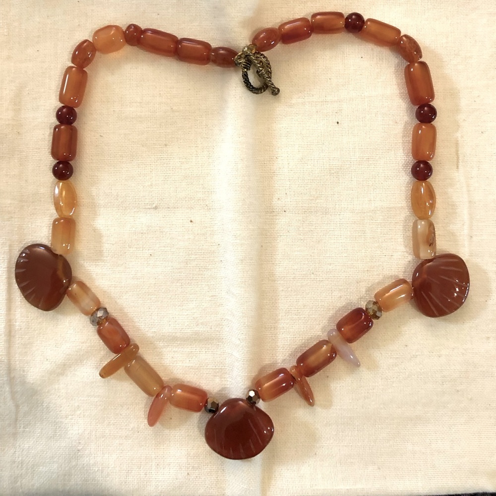Single, strand, carnelian necklace with shell shaped beads